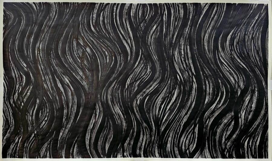 Long wavering black ribbons rising in vertical bands across a wide sheet, like flame or windblown hair.