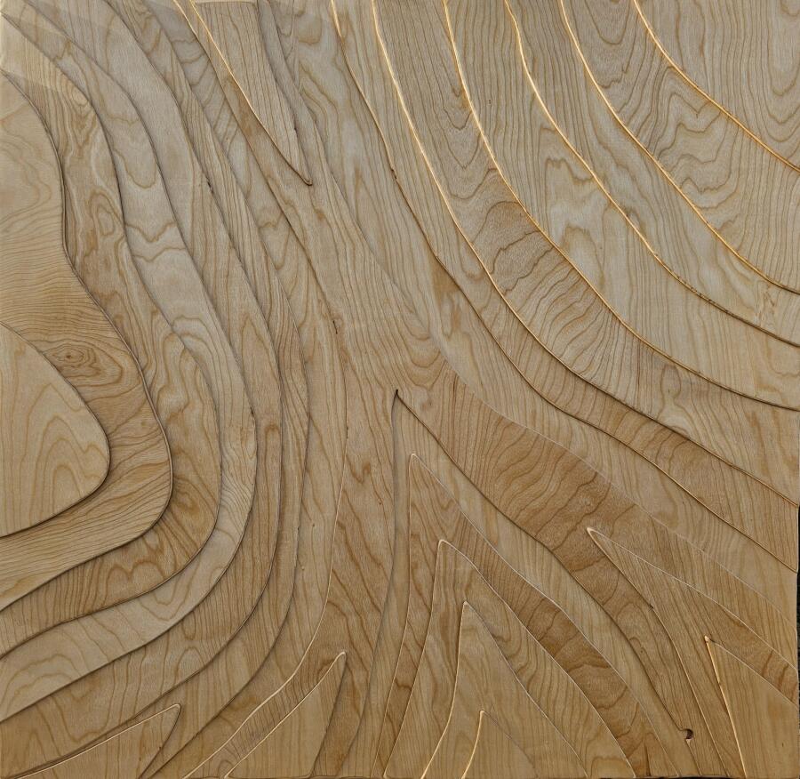 Birch plywood carved into sweeping curved contours that follow the grain outward like the lines of a topographic map.