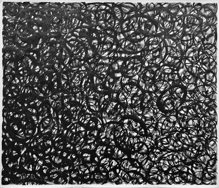 Overlapping black circles and loops drawn in one continuous tangle across the whole sheet.